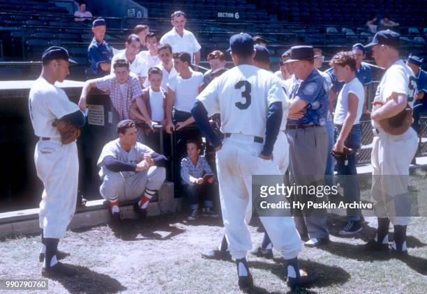 Ted Williams of the Boston Red Sox shows his swing to fans and players of the Brooklyn Dodgers during Spring Training on March 18, 1956 in Vero...