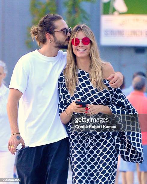 Heidi Klum and boyfriend Tom Kaulitz show some PDA while out and about in Manhattan on July 2, 2018 in New York City.