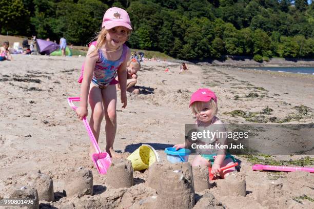 Roslyn Montague and her sister Susannah from Lauder build a sand castle on Silver Sands beach at the start of the Scottish school holidays as the...