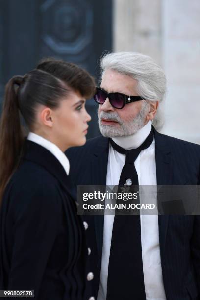 German fashion designer Karl Lagerfeld acknowledges the audience at the end of the Chanel 2018-2019 Fall/Winter Haute Couture collection fashion show...