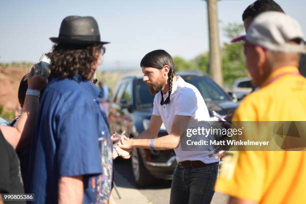Seth Avett of The Avett Brothers signs autographs at Red Rocks Amphitheatre on July 1, 2018 in Morrison, Colorado.