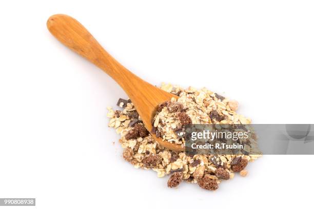 healthy oat granola muesli cereals with chocolate in a spoon on white - chocolate flake bildbanksfoton och bilder
