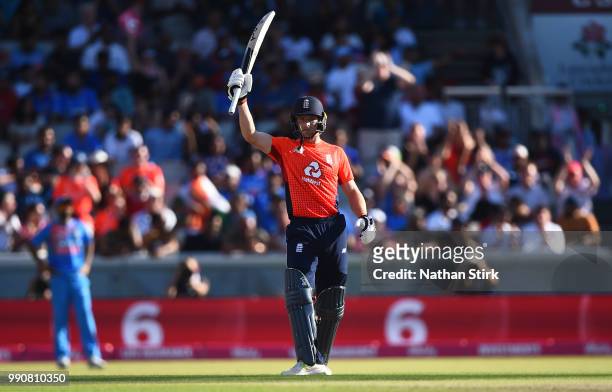 Jos Buttler raises his bat after scoring 50 runs during the 1st Vitality International T20 match between England and India at Emirates Old Trafford...