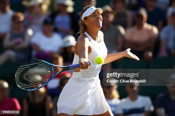 Maria Sharapova of Russia returns against Vitalia Diatchenko of Russia during their Ladies' Singles first round match on day two of the Wimbledon...