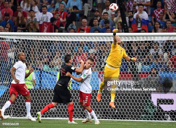 Goalkeeper Kasper Schmeichel of Denmark saves the ball during the 2018 FIFA World Cup Russia Round of 16 match between Croatia and Denmark at the...