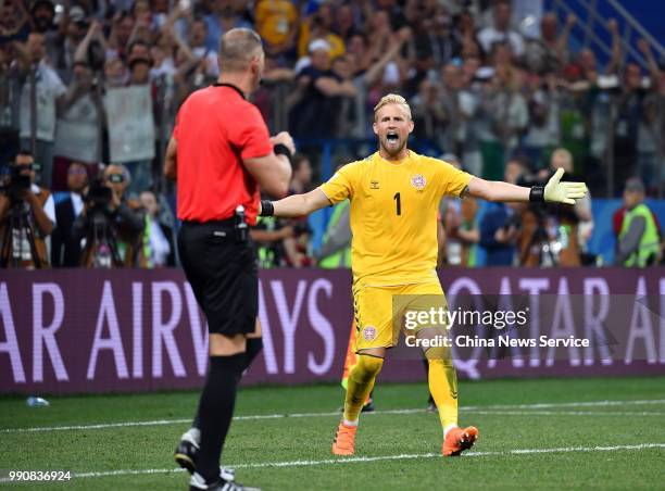 Goalkeeper Kasper Schmeichel of Denmark argues with referee Nestor Pitana during the 2018 FIFA World Cup Russia Round of 16 match between Croatia and...