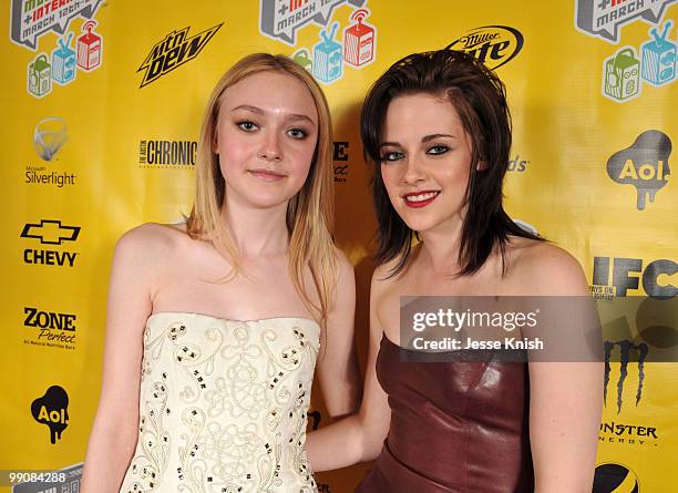 Dakota Fanning and Kristen Stewart attend the movie premiere of "The Runaways" during the 2010 SXSW Festival on March 18, 2010 in Austin, Texas.