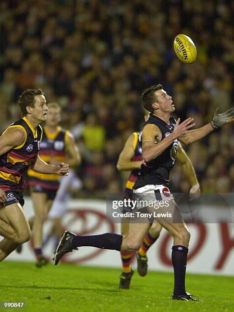 Adam Pickering for Carlton beats Andrew Eccles for Adelaide to the ball in the match between the Carlton Blues and the Adelaide Crows in round 19 of...