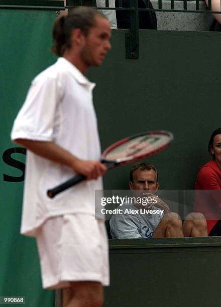 David Felgate former coach of Tim Henman watches his new player Xavier Malisse of Belguim before losing his third round match against Michael Russell...