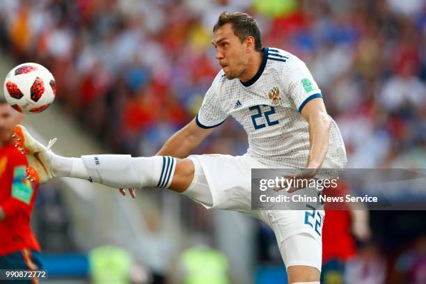 Artyom Dzyuba of Russia drives the ball during the 2018 FIFA World Cup Russia Round of 16 match between Spain and Russia at Luzhniki Stadium on July...