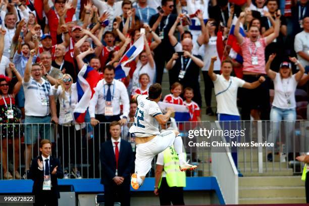 Artyom Dzyuba of Russia celebrates after scoring a goal on a penalty during the 2018 FIFA World Cup Russia Round of 16 match between Spain and Russia...