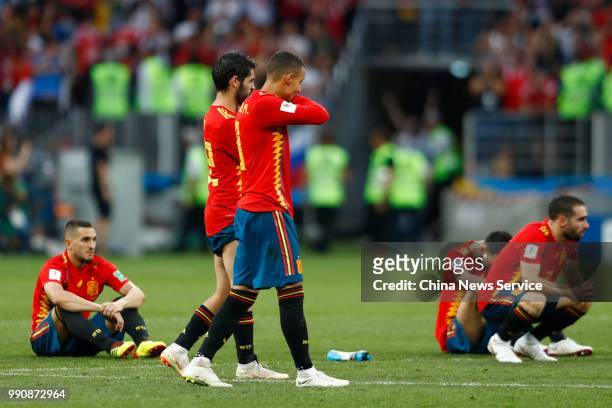 Players of Spain react after losing the penalty shoot-out during the 2018 FIFA World Cup Russia Round of 16 match between Spain and Russia at...