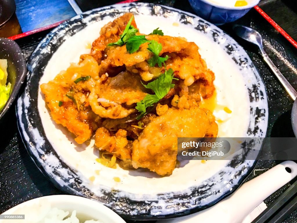 Guobaorou, twice deep fried crispy pork slice with sweet and sour sauce