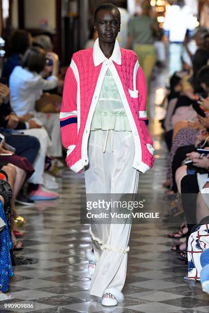 Alek Wek walks the runway during the finale of the Miu Miu 2019 Cruise Collection Show at Hotel Regina on June 30, 2018 in Paris, France.