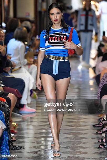 Adriana Lima walks the runway during the finale of the Miu Miu 2019 Cruise Collection Show at Hotel Regina on June 30, 2018 in Paris, France.