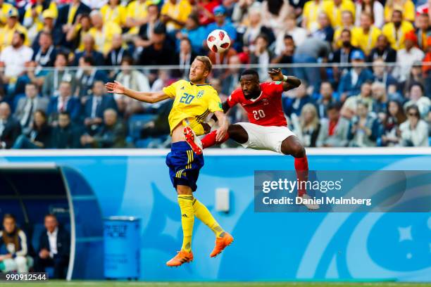 Ola Toivonen of Sweden in a header with Johan Djourou of Switzerland during the 2018 FIFA World Cup Russia Round of 16 match between Sweden and...