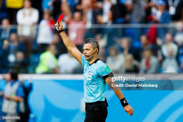 Refeeree Damir Skomina of Slovenia shows the red card during the 2018 FIFA World Cup Russia Round of 16 match between Sweden and Switzerland at Saint...