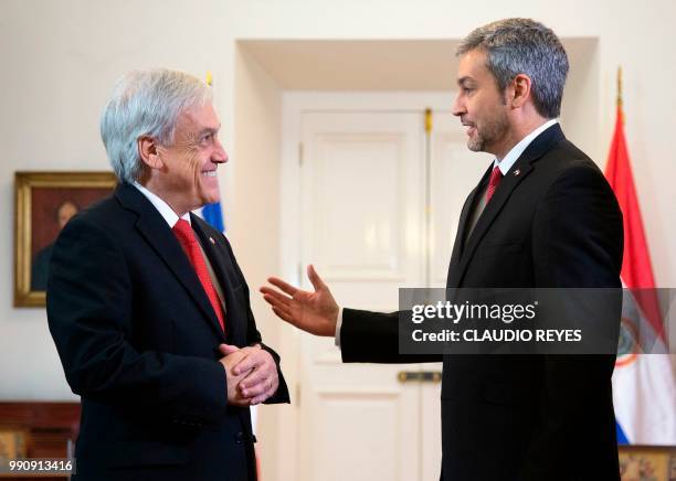 Paraguayan President elect Mario Abdo Benitez speaks with Chilean President Sebastian Pinera during a meeting at La Moneda presidential palace in...