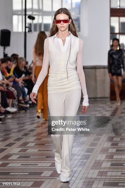 Model walks the runway during the Acne Studios Womenswear Spring Summer 2019 show during the Paris Fashion Week on July 1, 2018 in Paris, France.