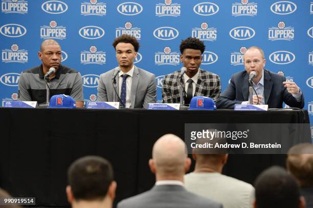 Head Coach Doc Rivers Raft Picks Jerome Robinson and Shai Gilgeous-Alexander along with Lawrence Frank look on during the Draft Press Conference at...
