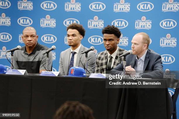 Head Coach Doc Rivers Raft Picks Jerome Robinson and Shai Gilgeous-Alexander along with Lawrence Frank look on during the Draft Press Conference at...