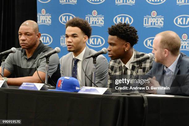 Head Coach Doc Rivers Raft Picks Jerome Robinson and Shai Gilgeous-Alexander along with Lawrence Frank look on during the Draft Press Conference at...