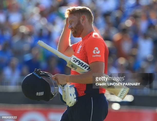 England's Jonny Bairstow leaves the crease after getting out stumped during the international Twenty20 cricket match between England and India at Old...