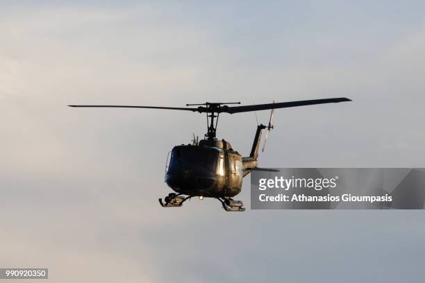 Huey helicopters performs an aerobatic display during the Kavala Air Sea Show on June 30, 2018 in Kavala, Greece. The Iroquois was originally...
