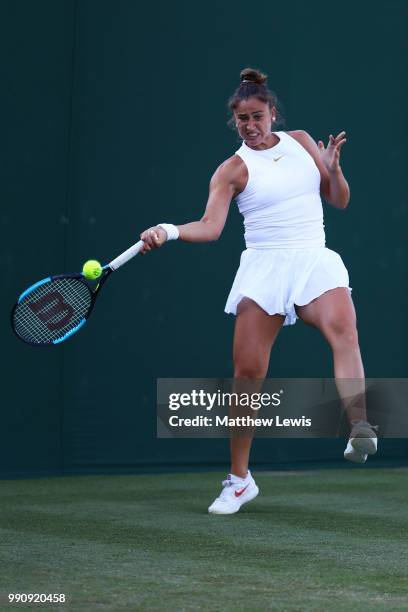 Sara Sorribes Tormo of Spain returns against Kaia Kanepi of Estonia during their Ladies' Singles first round match on day two of the Wimbledon Lawn...