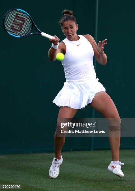 Sara Sorribes Tormo of Spain returns against Kaia Kanepi of Estonia during their Ladies' Singles first round match on day two of the Wimbledon Lawn...