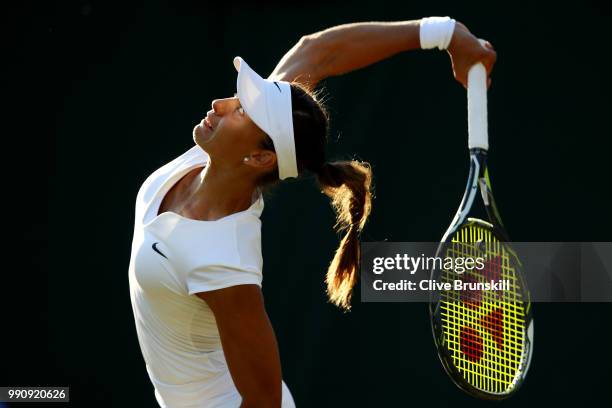 Vitalia Diatchenko of Russia serves against Maria Sharapova of Russia during their Ladies' Singles first round match on day two of the Wimbledon Lawn...