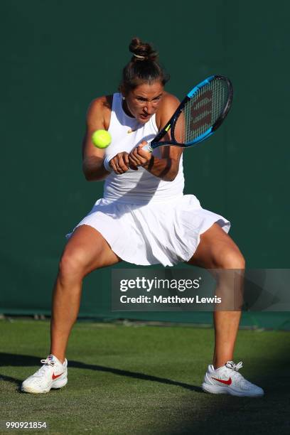 Sara Sorribes Tormo of Spain returns against Kaia Kanepi of Estonia during their Ladies' Singles first round match on day two of the Wimbledon Lawn...