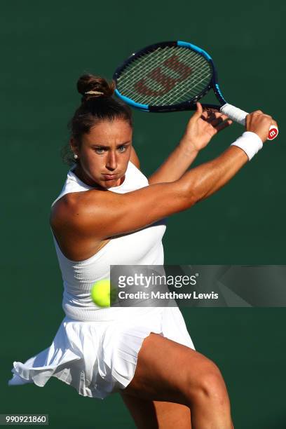 Sara Sorribes Tormo of Spain returns against Kaia Kanepi of Estonia during their Ladies' Singles first round match on day two of the Wimbledon Lawn...