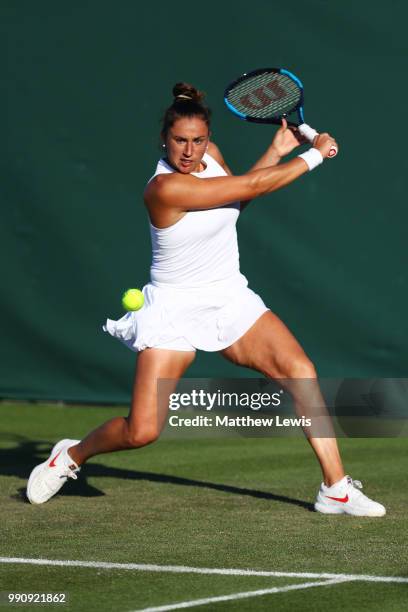 Sara Sorribes Tormo of Spain returns against Kaia Kanepi of Estonia during their Ladies' Singles first round match on day two of the Wimbledon Lawn...