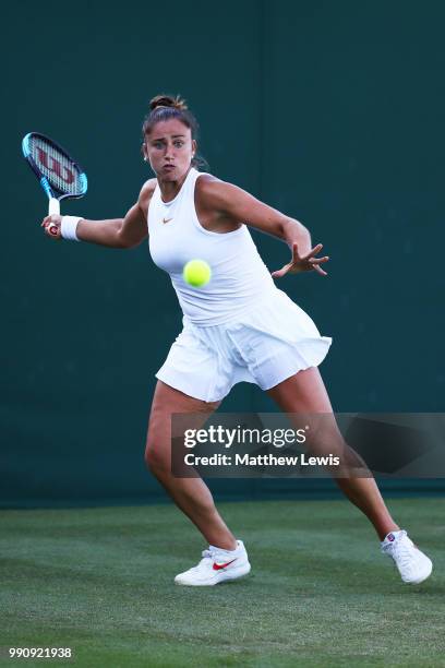 Sara Sorribes Tormo of Spain returns against Kaia Kanepi of Estonia during their Ladies' Singles first round match on day two of the Wimbledon Lawn...