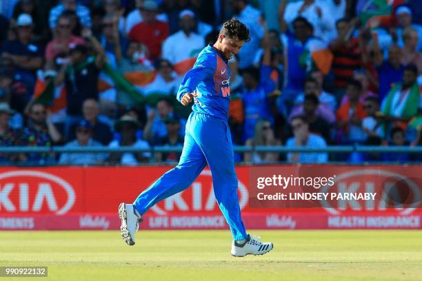 India's Kuldeep Yadav celebrates taking the wicket of England's Joe Root during the international Twenty20 cricket match between England and India at...