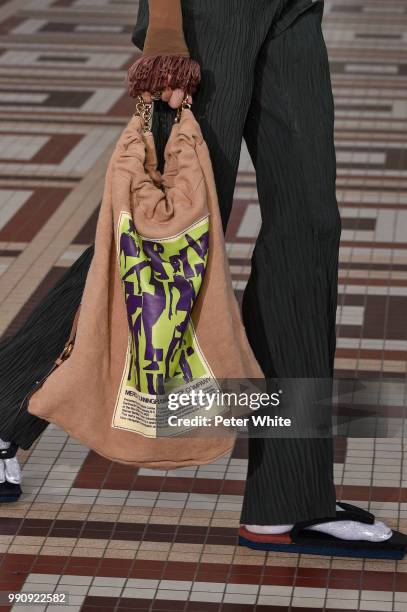 Model, bag detail, walks the runway during the Acne Studios Womenswear Spring Summer 2019 show during the Paris Fashion Week on July 1, 2018 in...