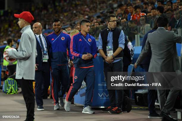 An injured James Rodriguez of Colombia walks to the bench prior to the 2018 FIFA World Cup Russia Round of 16 match between Colombia and England at...