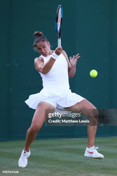 Sara Sorribes Tormo of Spain returns against Kaia Kanepi of Estonia during their Ladies' Singles first round match on day two of the Wimbledon Lawn...