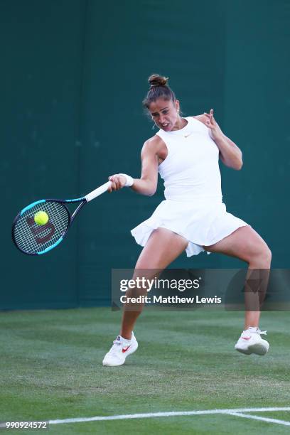 Sara Sorribes Tormo of Spain returns against Kaia Kanepi of Estonia during their Ladies' Singles first round match on day two of the Wimbledon Lawn...