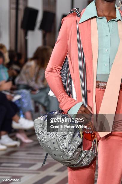 Model, bag detail, walks the runway during the Acne Studios Womenswear Spring Summer 2019 show during the Paris Fashion Week on July 1, 2018 in...