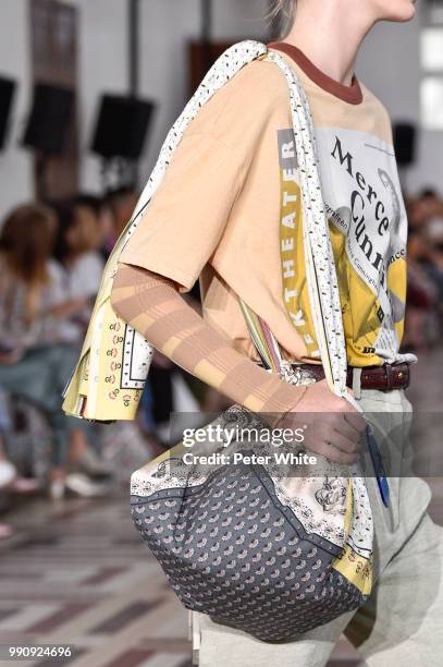 Model, bag detail, walks the runway during the Acne Studios Womenswear Spring Summer 2019 show during the Paris Fashion Week on July 1, 2018 in...