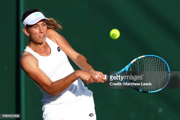 Elise Mertens of Belgium returns against Danielle Collins of The United States on day two of the Wimbledon Lawn Tennis Championships at All England...