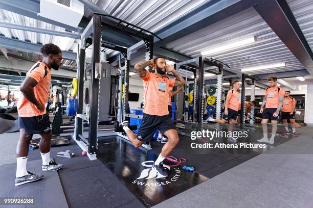 Nathan Dyer, Kyle Bartley and other players exercise in the gym during a Swansea City Training Session at The Fairwood Training Ground on July 03,...