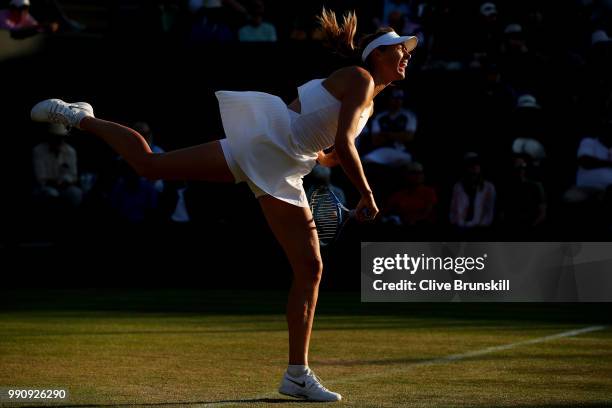 Maria Sharapova of Russia serves against Vitalia Diatchenko of Russia during their Ladies' Singles first round match on day two of the Wimbledon Lawn...