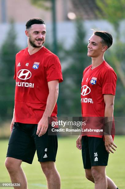 Dorian Grange and Maxence Caqueret of Lyon take part to a training session at the Groupama OL training center during the training session of the...