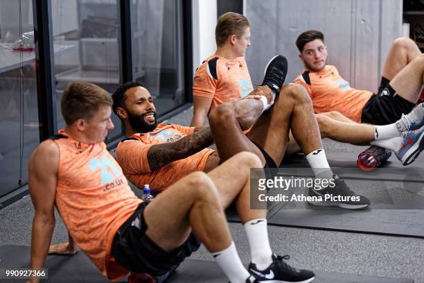 Kyle Bartley and team mates exercise in the gym during a Swansea City Training Session at The Fairwood Training Ground on July 03, 2018 in Swansea,...