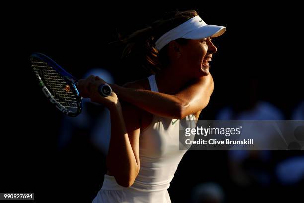 Maria Sharapova of Russia returns against Vitalia Diatchenko of Russia during their Ladies' Singles first round match on day two of the Wimbledon...