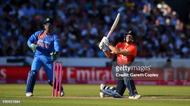 David Willey of England hits out for six runs during the 1st Vitality International T20 match between England and India at Emirates Old Trafford on...