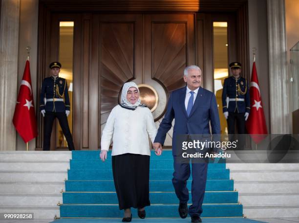 Turkish Prime Minister Binali Yildirim and his wife Semiha Yildirim attend a farewell programme at the official ceremony area of the garden of...